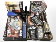 Two boxes containing Star Wars toys, Lord of the Rings videos, Star Wars Hero Mashers figures, etc.