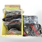A quantity of new retail stock items including a bed tray, various bags and holdalls.