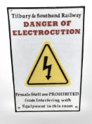 A metal electrocution railway sign.