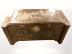 An early 20th century carved camphor wood chest,