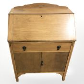 A 1930's oak bureau,