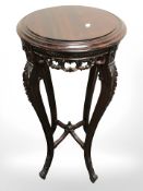A reproduction mahogany plant stand,