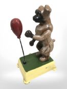 A cast iron figure of a boxing dog.