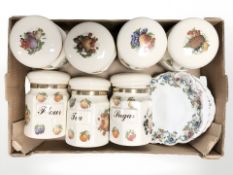 A group of Staffordshire earthenware kitchen storage jars decorated with fruit,