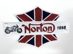 A cast Norton sign