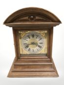 An Edwardian oak bracket clock, height 32 cm.