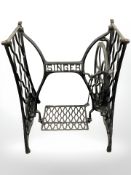 An antique treadle sewing machine base.