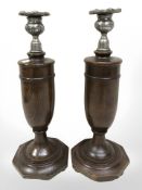 A pair of 1930's oak candlesticks, height 31 cm.