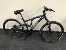 A Cross DXT700 mountain bike.