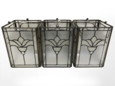 Three antique-style glazed metal light shades, each width 16 cm.