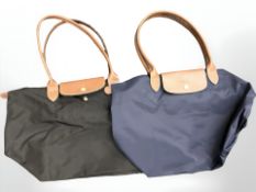 Two Longchamp leather handled bags. (2) CONDITION REPORT: In new unused condition.