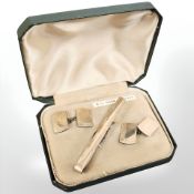 A 9ct yellow gold on silver Gentleman's dress set including tie bar and pair of cufflinks
