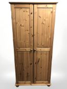 A pine double door wardrobe,