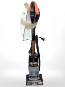 A Shark Duoclean vacuum cleaner with accessories.