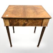 A mid 20th century walnut occasional table fitted a drawer,