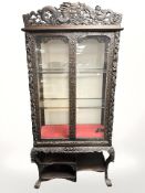 A 19th century Chinese heavily-carved hardwood double door glazed display cabinet, width 99 cm,