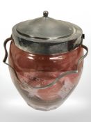 A Victorian cranberry glass biscuit barrel.