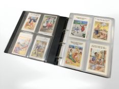 A large album containing approximately 275 humorous postcards.