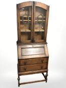 A 1920's oak bureau bookcase,