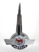 A Morris metal bonnet logo.
