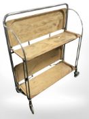 An Art Deco chrome trolley with folding trays, width 61 cm.