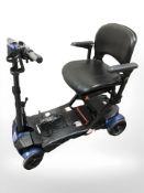 An electric mobility scooter with charger and keys