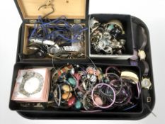 A collection of costume jewellery, dress rings, bangles, beads, wristwatches.