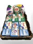 A crate containing boxes of fabric soap, Fairy platinum dishwasher tablets, Bold,