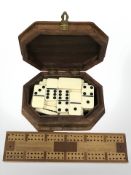 A brass inlaid box together with a set of dominoes and a cribbage board.