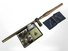 A First World War brass periscope with oak handle, together with military badges, buttons,