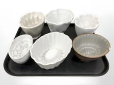 Six antique jelly moulds.