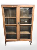 An Edwardian mahogany bookcase, width 90 cm.