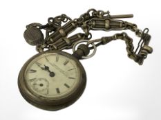 A Victorian brass pocket watch on chain.