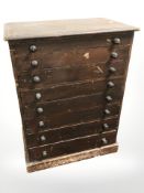 A Victorian stained beech wood eight drawer miniature chest,