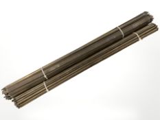 Two bundles of Victorian brass stair rods.