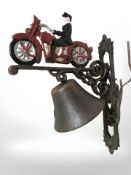 A cast motorcycle bell on bracket.