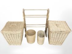 A pine towel rail, together with two wicker laundry baskets and two wicker bins.