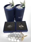 A group of Swarovski crystal ornaments including grapes, endangered wildlife issue ornaments, etc.