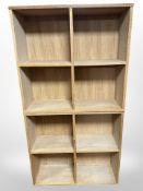 A pair of light oak bookcases, width each 75 cm.