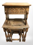 A carved oak storage stool.