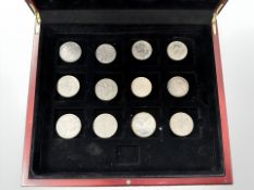 A group of twelve Crown-sized silver coins including 1821 Crown.