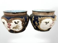 A pair of 19th century glazed earthenware planters, height 16 cm.