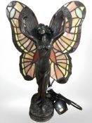 A TIffany style bronze effect table lamp, modelled as an angel,