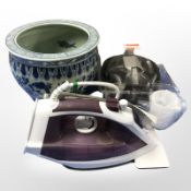 A reproduction Chinese porcelain planter, a pair of headphones, a Bosch iron.
