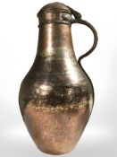 A middle eastern copper plated lidded jug, height 40 cm.