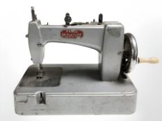 An Essex miniature sewing machine.