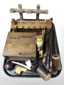 An antique Electro-Medico box, collection of pipes and pipe racks.