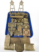 Brass wares including shallow embossed dishes, plaques, decorative trivet, pair of miniature easels,