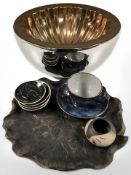 A large contemporary copper effect bowl, five Sally Seymour zodiac dishes,