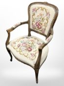 A continental walnut tapestry seated armchair, width 60 cm.